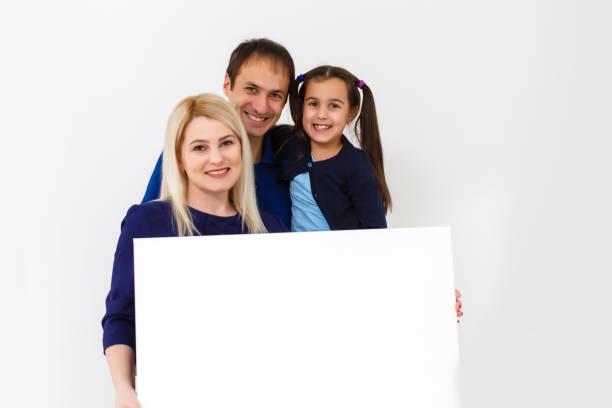 istock family holds holds a large photo canvas 1220378219