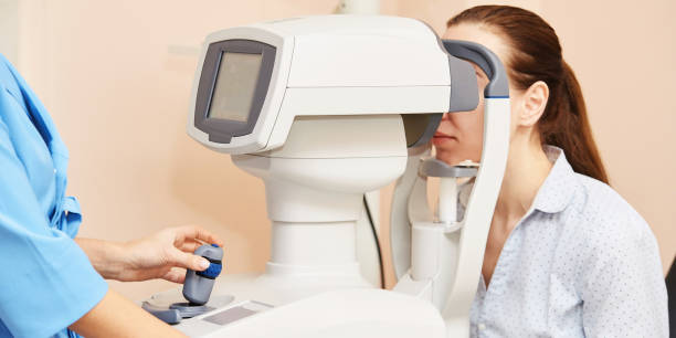 ophthalmologist doctor in exam optician laboratory with female patient. Eye care ophthalmologist doctor in exam optician laboratory with female patient. Eye care medical diagnostic. Eyelid treatment glaucoma photos stock pictures, royalty-free photos & images