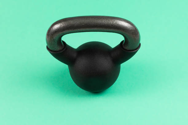 istock Black weight on green background. 4 kg weight. 1220378720