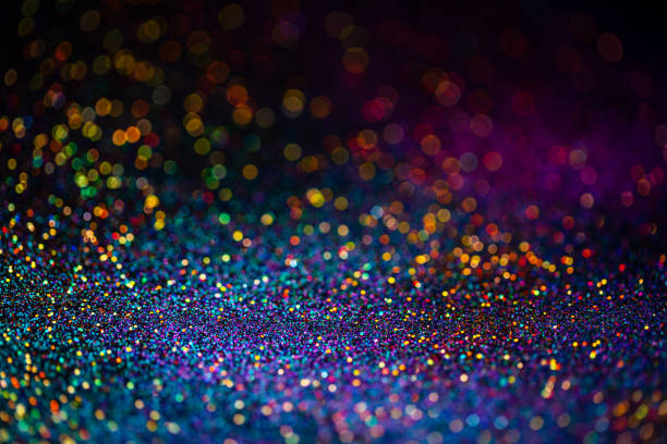istock Shiny multicolor glitter raster background. Abstract shimmering pink, blue, yellow circles decorative backdrop. Bokeh lights effect illustration. Overlapping glowing and twinkling spots. 1220379649