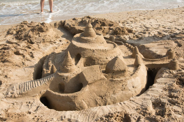 istock sand castle by the sea 1220379669
