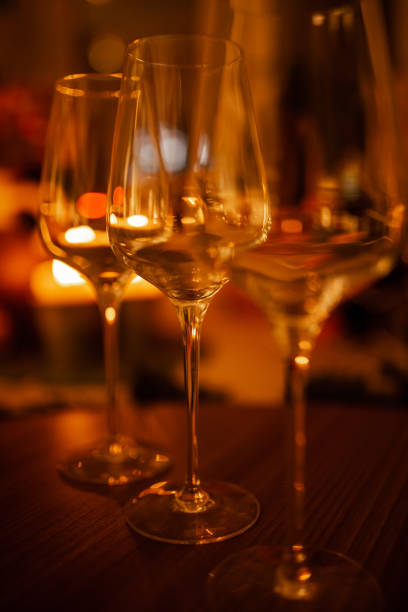 istock empty wine glasses with a blurred background. Warm color 1220379961
