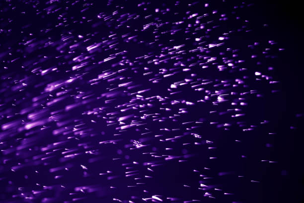 istock Abstract bokeh purple proton dust distribution water freeze blurred background 1220381474