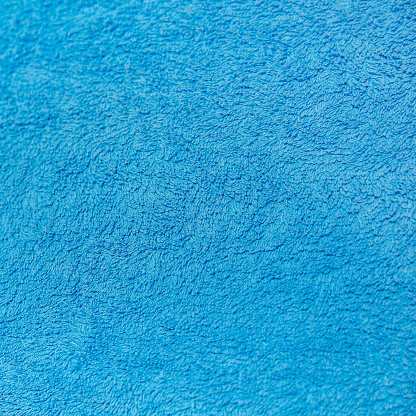 Full frame details of loop pile blue carpet texture background