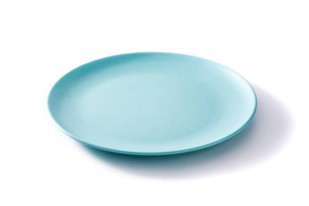 empty blue plate on white background - blue plate fotos imagens e fotografias de stock