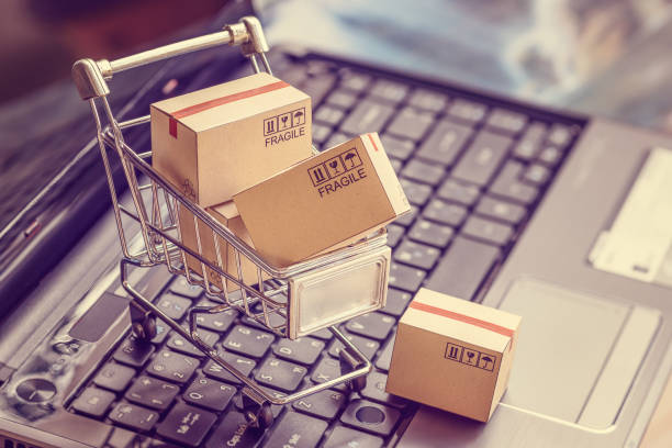 istock Boxes with shopping cart on a laptop computer keyboard 1220383355