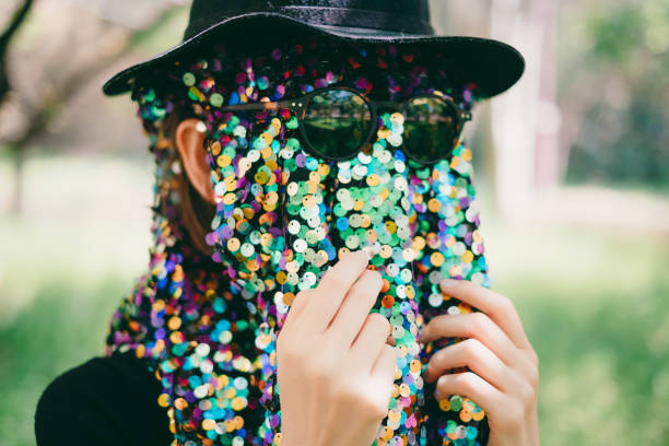 Carnival mask with some confetti on a white background