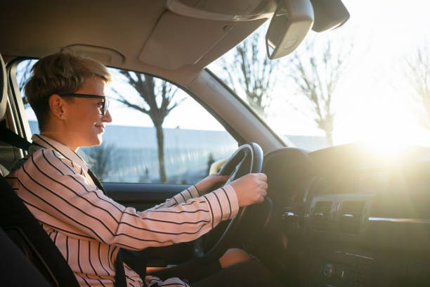 istock Smiling woman in a car 1220383838