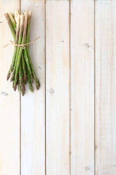 istock delicious and healthy asparagus on wood 1220384015