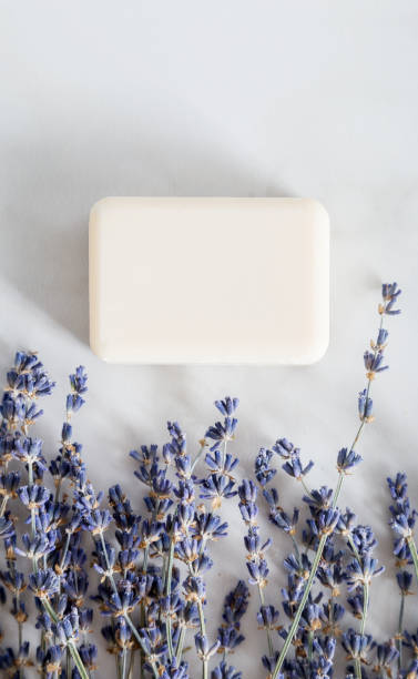istock Top view composition with aromatic soap for hands and lavender flowers on white marble background. 1220385305