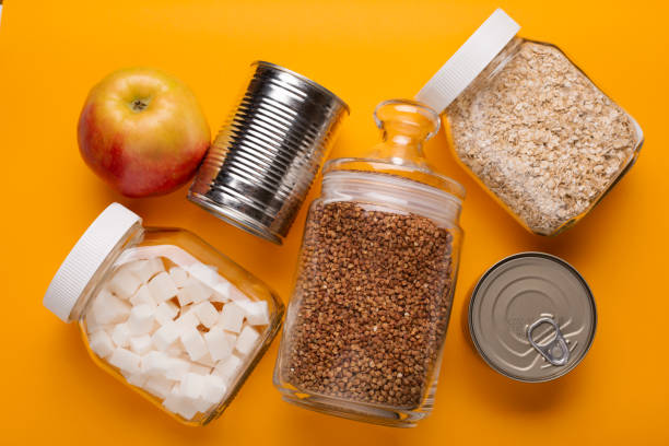 istock different food on yellow table, donation concept 1220385410