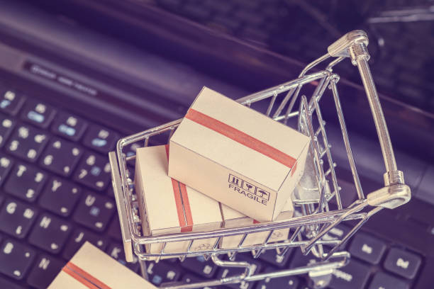 istock Boxes with shopping cart on a laptop computer keyboard 1220385441