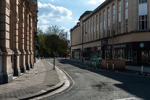 Cheltenham Spa is often a busy small town. With the likes of John Lewis and other high end retail chains on the High Street, the pandemic has brought the local economy to a standstill. This photograph is part of a large series of photographs taken around Cheltenham.