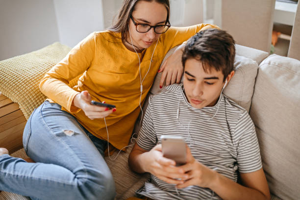 istock Teenagers using smart phones at home 1220386010