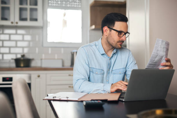 istock Young freelancer working at home on laptop. 1220386051