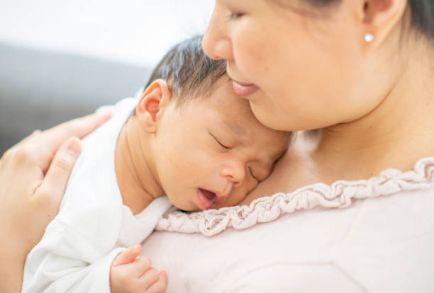 istock Mother and newborn baby 1220387345