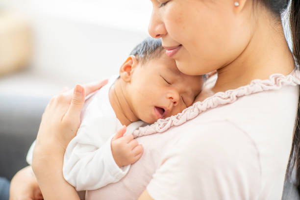 istock Mother and newborn baby 1220387350