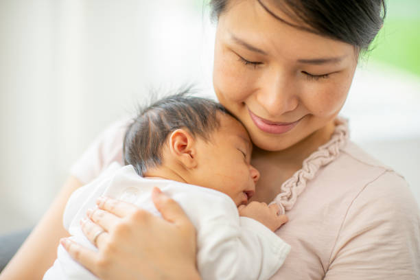 istock Mother and newborn baby 1220387358
