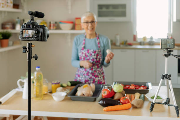 istock Female Vlogger Making Social Media Video About Cooking 1220387364