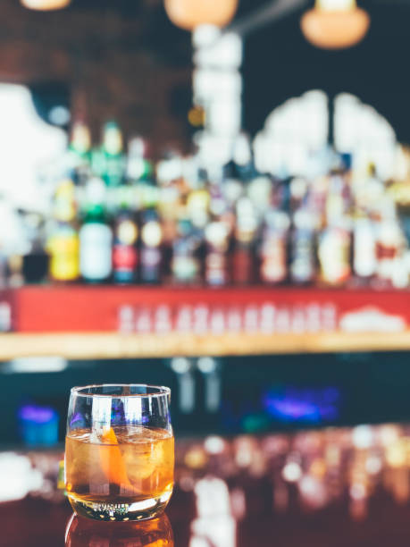 istock Old fashioned whiskey drink on bar counter 1220387463