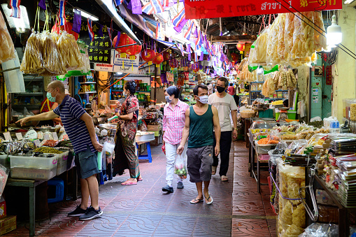 Bangkok, Thailand - April 22, 2020 : Thai people walking on the market at Chinatown or Yaowarat during quarantine at Bangkok.