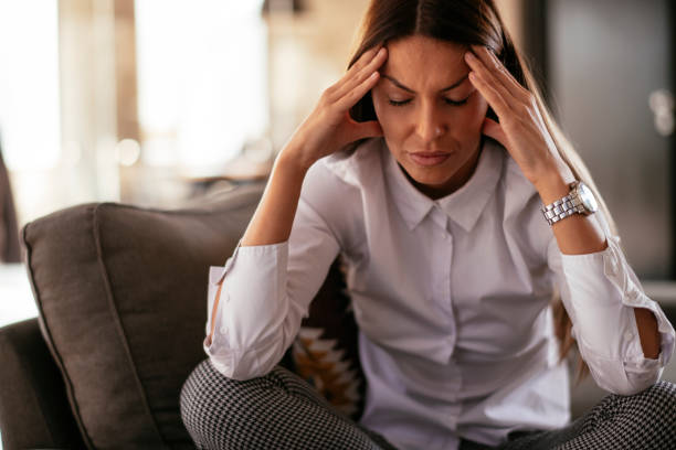 istock Woman with a stomach ache 1220389526