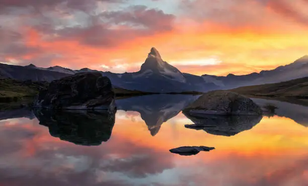 Matterhorn or Cervino reflection on lake stellisee in Zermatt in the mountains in the swiss Alps, Switzerland.