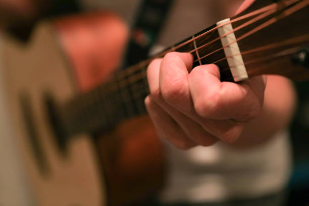 istock C chord on a guitar fret 1220391929