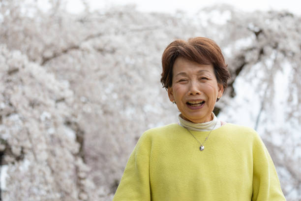 Japanese woman enjoying cherry blossom