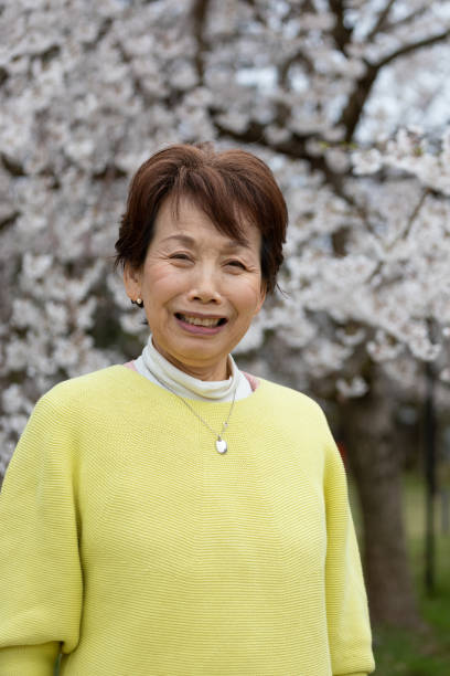 istock Japanese woman enjoying cherry blossom 1220395915