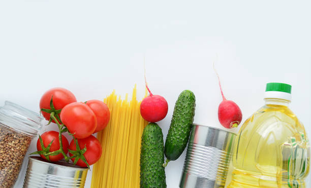 istock The main food: buckwheat, pasta, tomatoes, cucumbers, lettuce. Purchasing basic products. Quarantine. Set of quarantine food, concept. Food delivery coronavirus.food donation. 1220396320