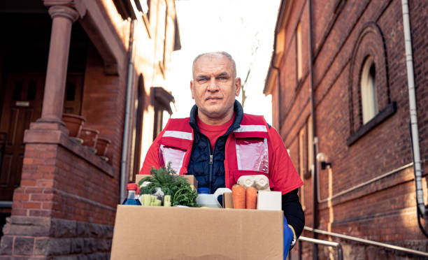 istock COVID-19, Donation Home food delivery during lockdown 1220396412