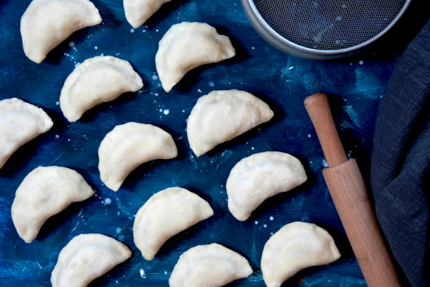 istock Raw dumpling with potatoes. Preparation dumplings. Raw varenyky 1220396579