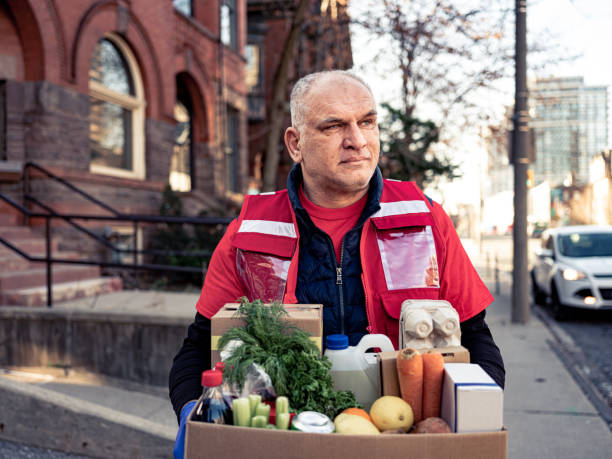 istock COVID-19, Donation Home food delivery during lockdown 1220396582