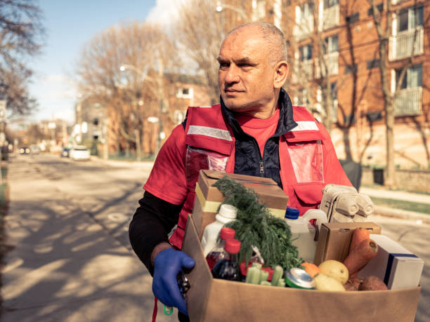 istock COVID-19, Donation Home food delivery during lockdown 1220397075