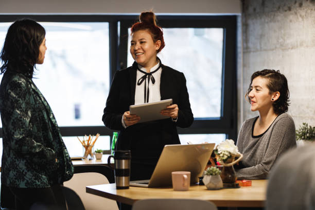 istock Three businesswomen taking a break at the workplace 1220397869
