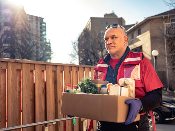 istock COVID-19, Donation Home food delivery during lockdown 1220397900