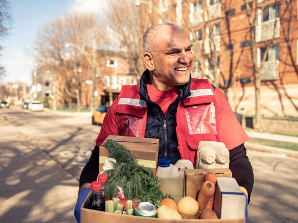 istock COVID-19, Donation Home food delivery during lockdown 1220398231