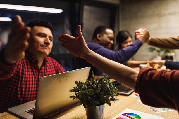 istock Graphic designers team giving a handshake 1220398233