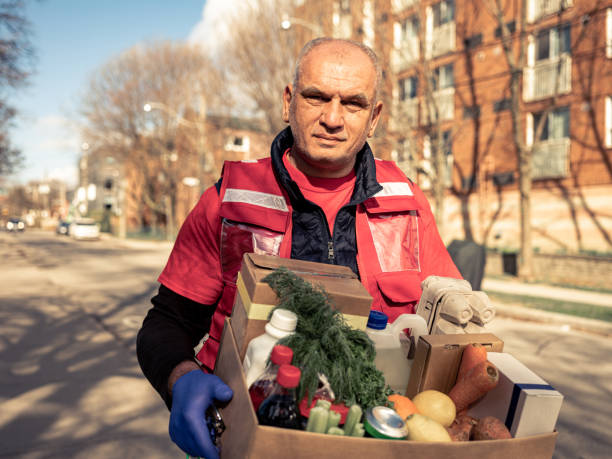 istock COVID-19, Donation Home food delivery during lockdown 1220398399
