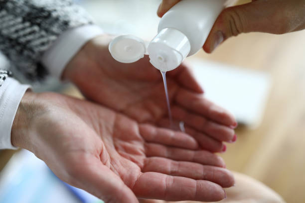istock Close-up on woman hands pouring an antiseptic 1220398801