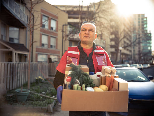 istock COVID-19, Donation Home food delivery during lockdown 1220399705