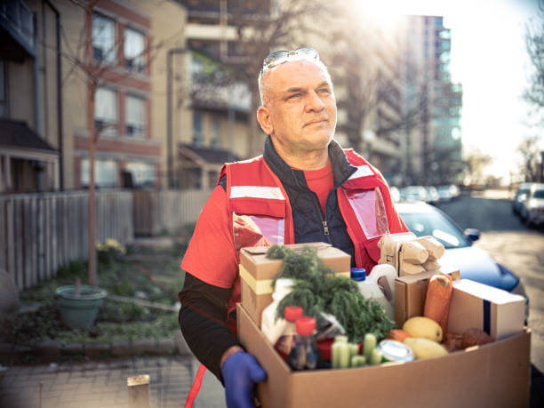 istock COVID-19, Donation Home food delivery during lockdown 1220399732