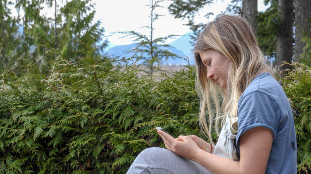 istock Young woman sends message on smart phone 1220400160
