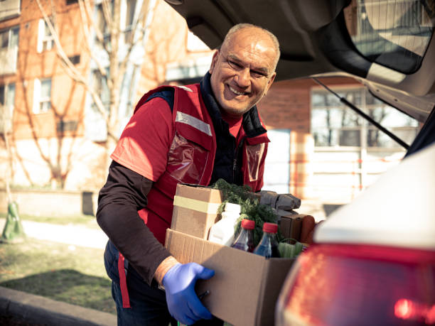 istock COVID-19, Donation Home food delivery during lockdown 1220400250