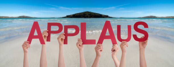 People Hands Holding Word Applause Means Applause, Ocean Background People Hands Holding Colorful German Word Applaus Means Applause. Ocean And Beach As Background applaus stock pictures, royalty-free photos & images