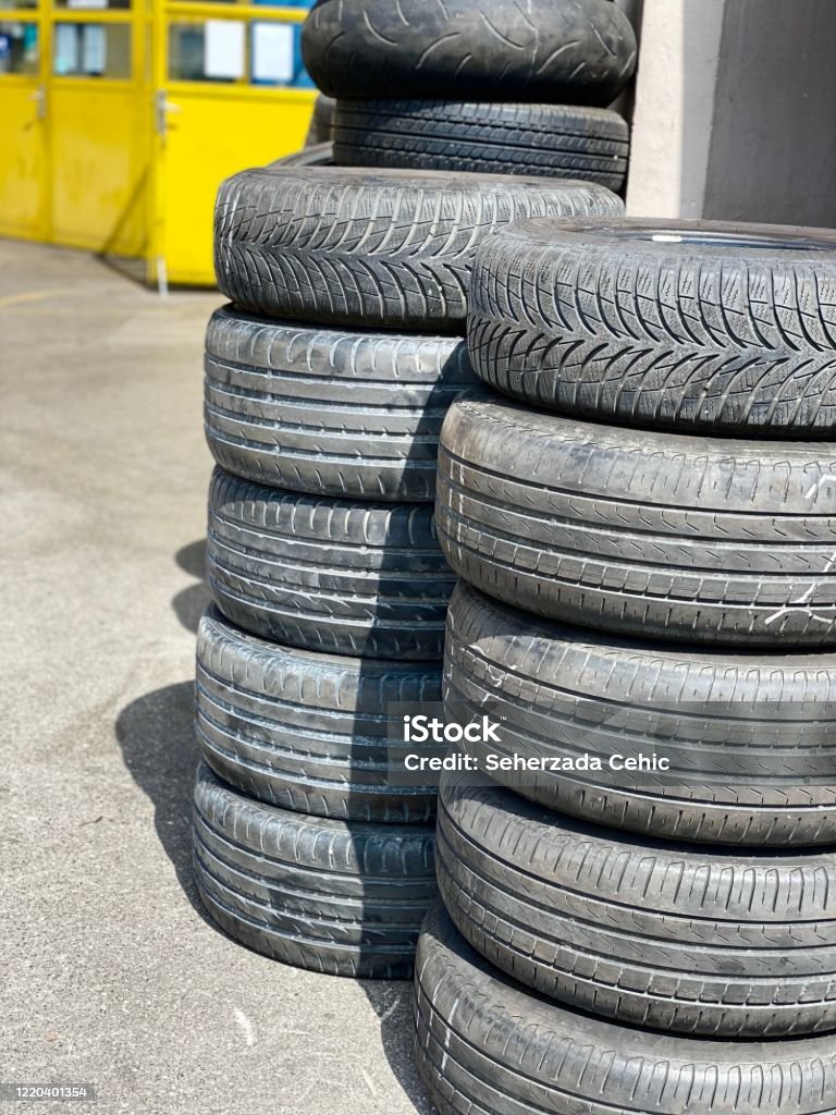 Car tires infront of Vulkanizer workshop yard Black Color Stock Photo