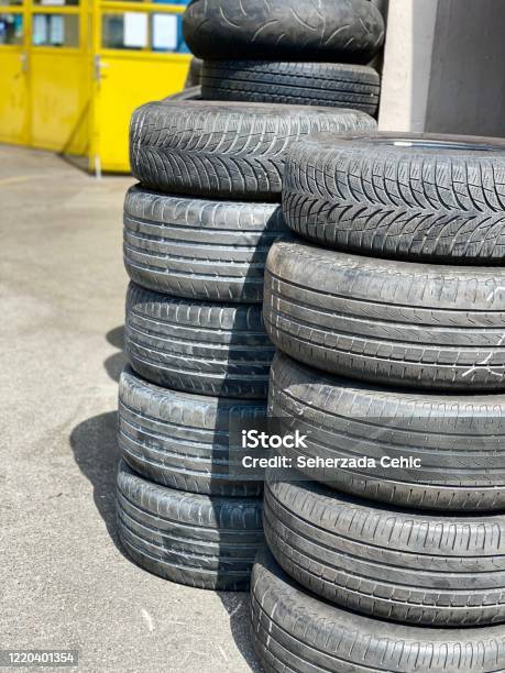 Car Tires Infront Of Vulkanizer Workshop Yard Stock Photo - Download Image Now - Black Color, Car, Close-up