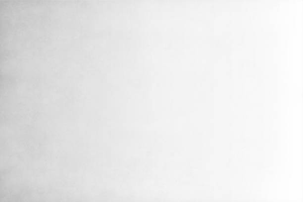 Light Grey and white coloured grunge effect empty background Vector Illustration of light Gray coloured textured grungy gradient empty background - suitable to use as wallpaper, background, vintage post cards, letters, manuscripts etc. drab stock illustrations