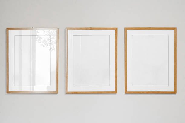 istock Interior decoration, empty wooden vertical frames, poster white canvas mock up on a white wall, living room template from view 1220401585